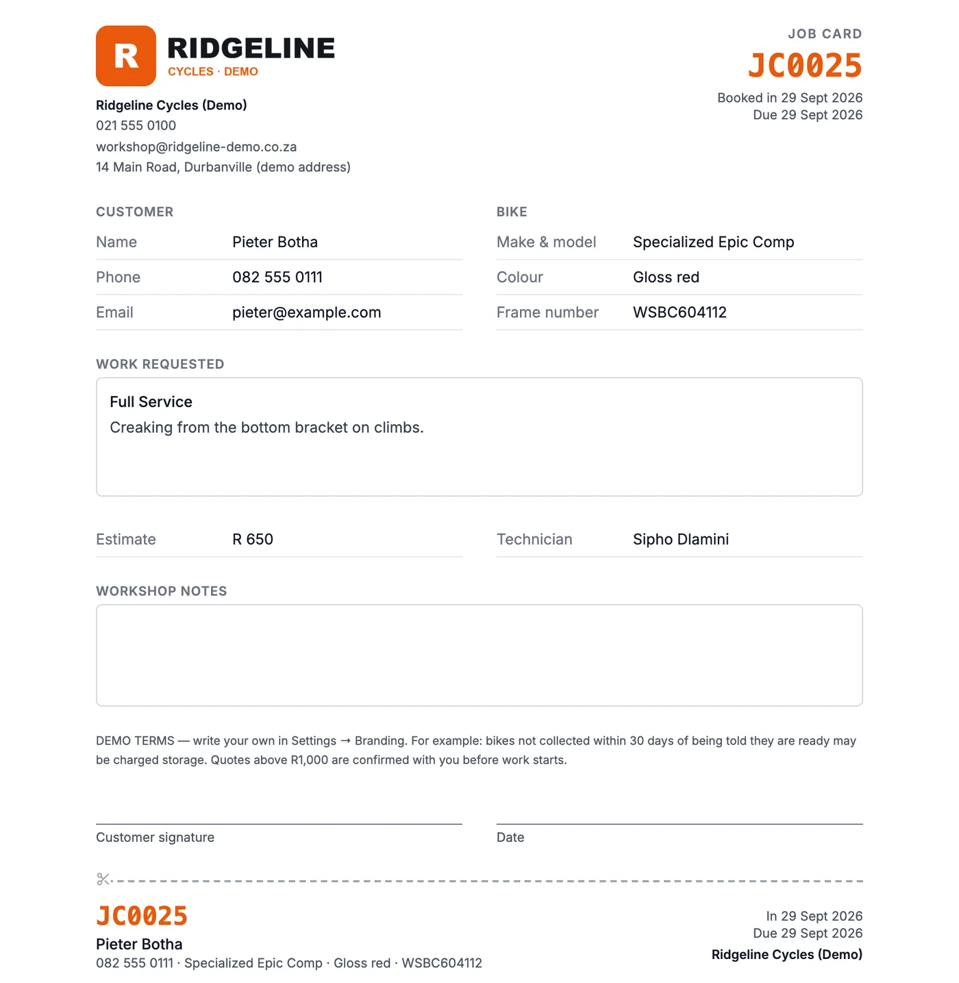 A printed job card for a demo bike shop with its logo, job number, customer, bike details, work requested, signature line and tear-off tag